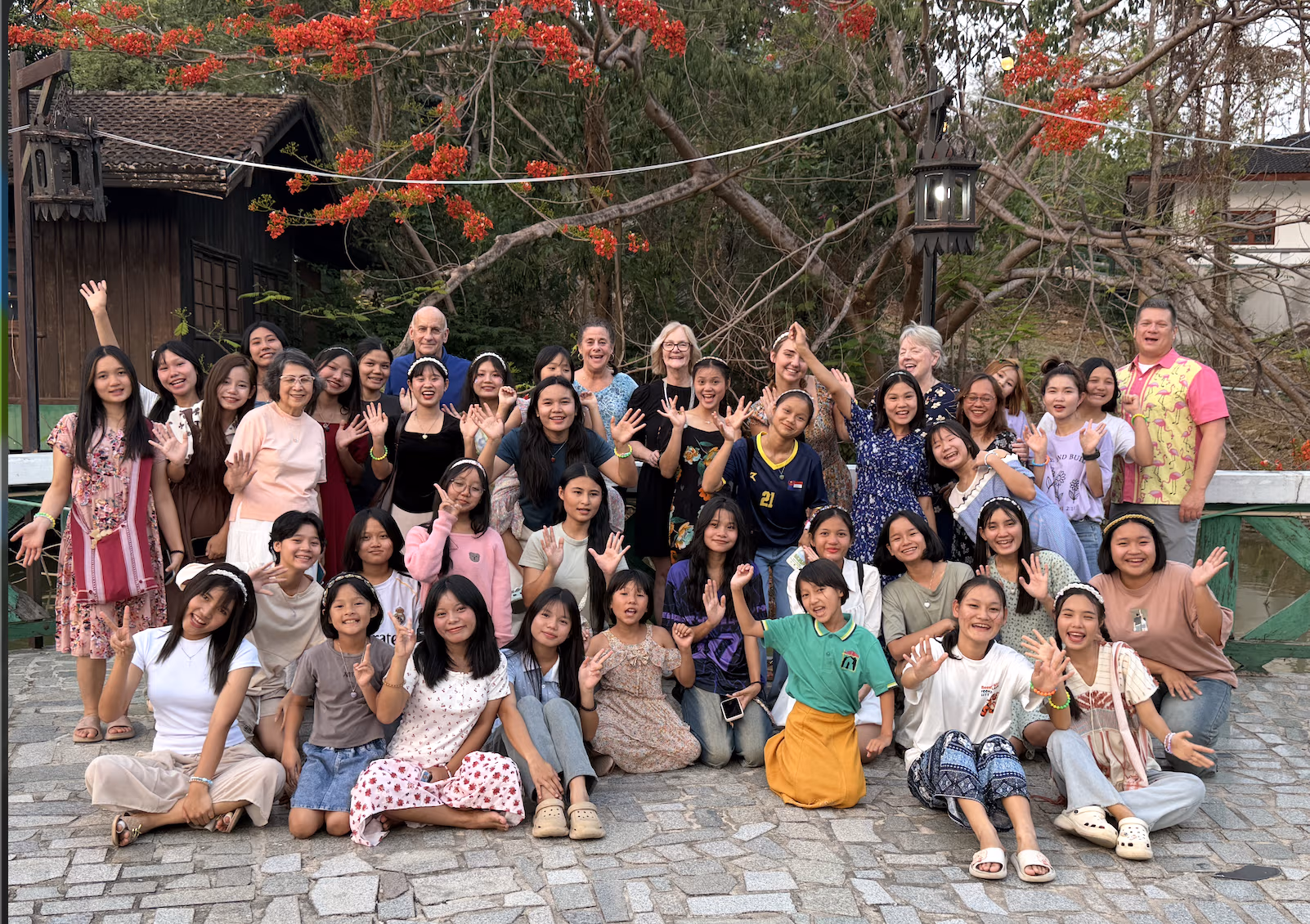 All of the Faith House girls and the mission team on the lake patio